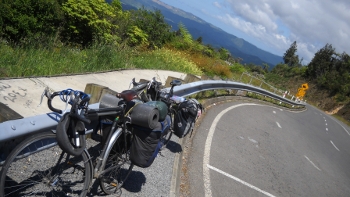 view back along the road at the big col between whitianga and coromandel town