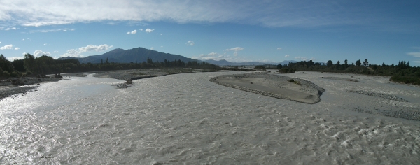 view of the orari river from the bridge on the road between geraldine and arundel